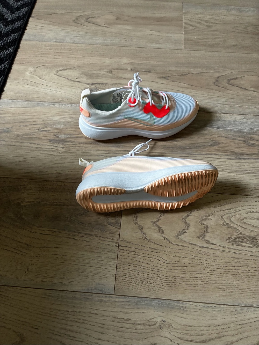 Nike White Athletic Shoes with Coral and Peach Accents